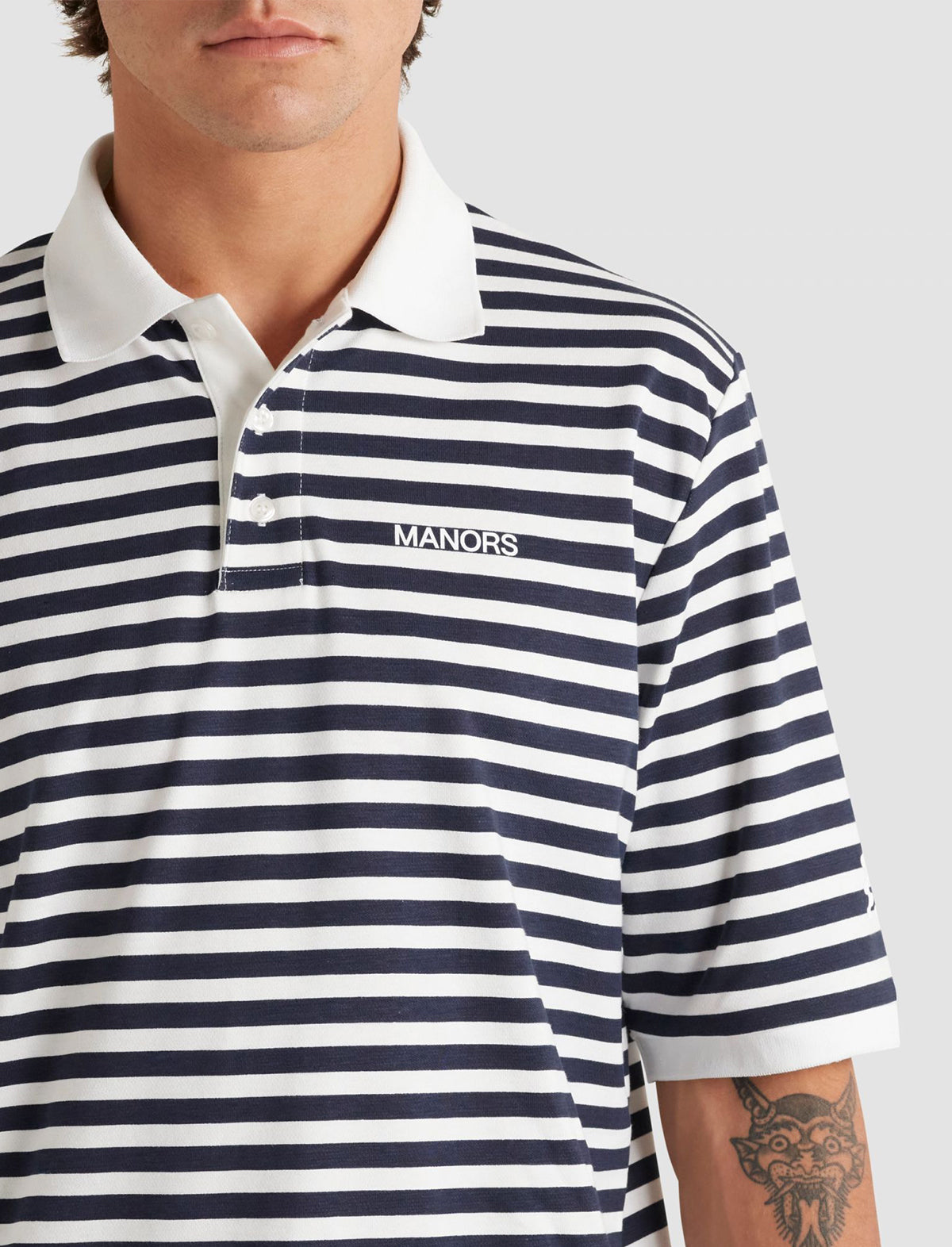 MANORS GOLF Striped Pique Polo in Cream / Navy