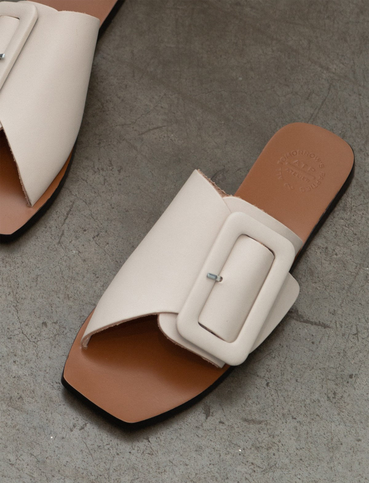 ATP Atelier Ceci Buckled Flat Sandals in White CLOSET Singapore